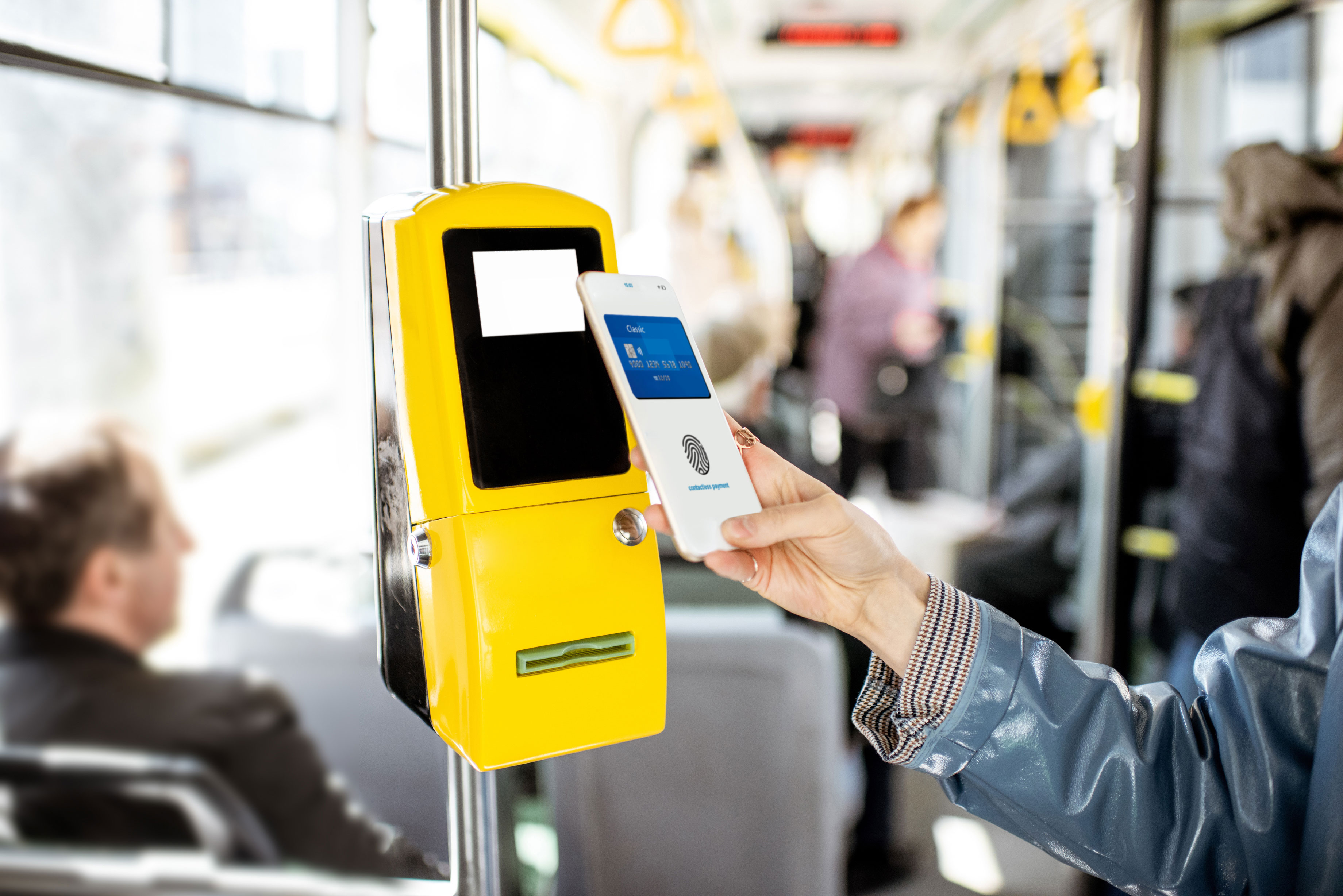 A contactless point of sale device mounted on a bus